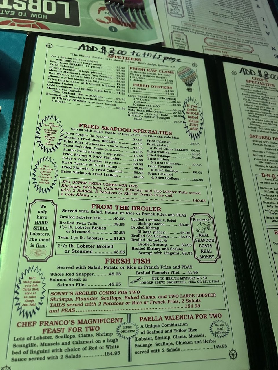 Menu page featuring seafood and pasta dishes.